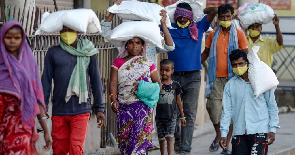 Indian Labors on their way to their work in the pandemic. 