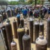 Healthcare workers line up empty oxygen cylinders to be refilled at the NESCO Covid centre in Mumbai in April 2021.