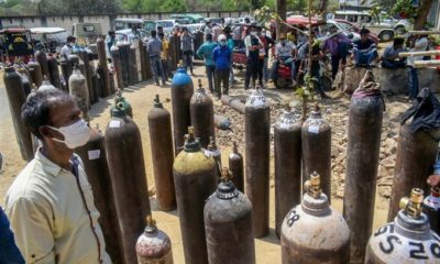 Healthcare workers line up empty oxygen cylinders to be refilled at the NESCO Covid centre in Mumbai in April 2021.