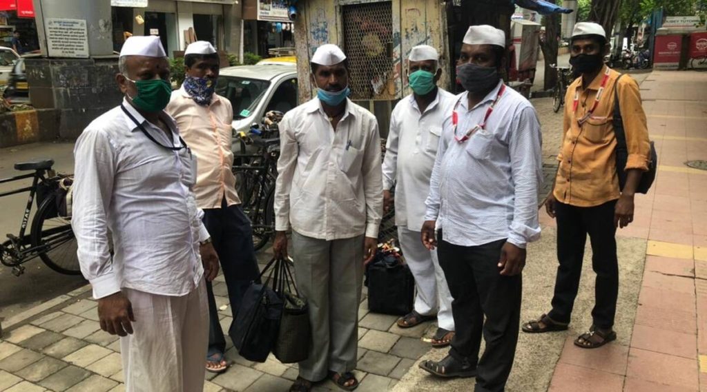 Mumbai's 'dabbawalas', hit with the aid of Covid-19, tie-up with an eating place chain to survive. 