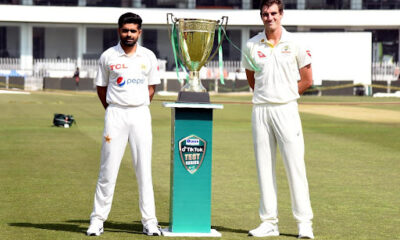 babar azam and cummins posing