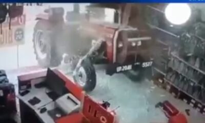 Tractor without driver enters the shop