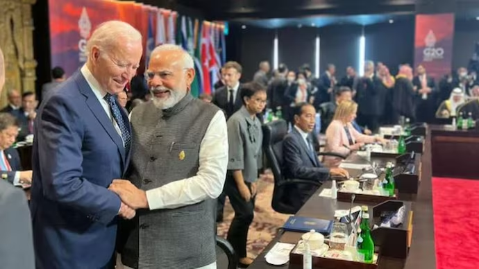 President Joe Biden talking with PM Narendra Modi.