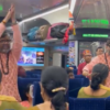 Passengers performing Yoga in train on Yoga day