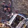 A bus carrying 65 passengers went down a highway in Gujarat, killing two children and injuring eight others.