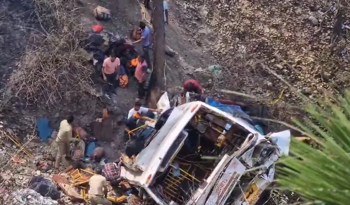 A bus carrying 65 passengers went down a highway in Gujarat, killing two children and injuring eight others.
