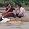 The couple, caught in shock by the flash flood, got stuck in their vehicle as the water flooded.