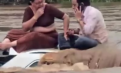 The couple, caught in shock by the flash flood, got stuck in their vehicle as the water flooded.